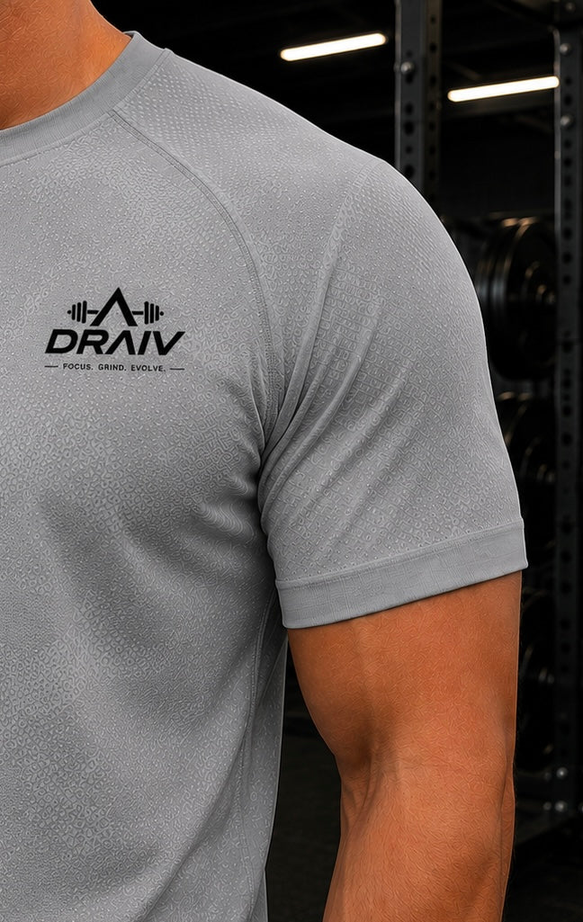Black Draiv Evolve T-Shirt from DraivStore with logo graphic, short sleeves, and casual fit on a plain background.